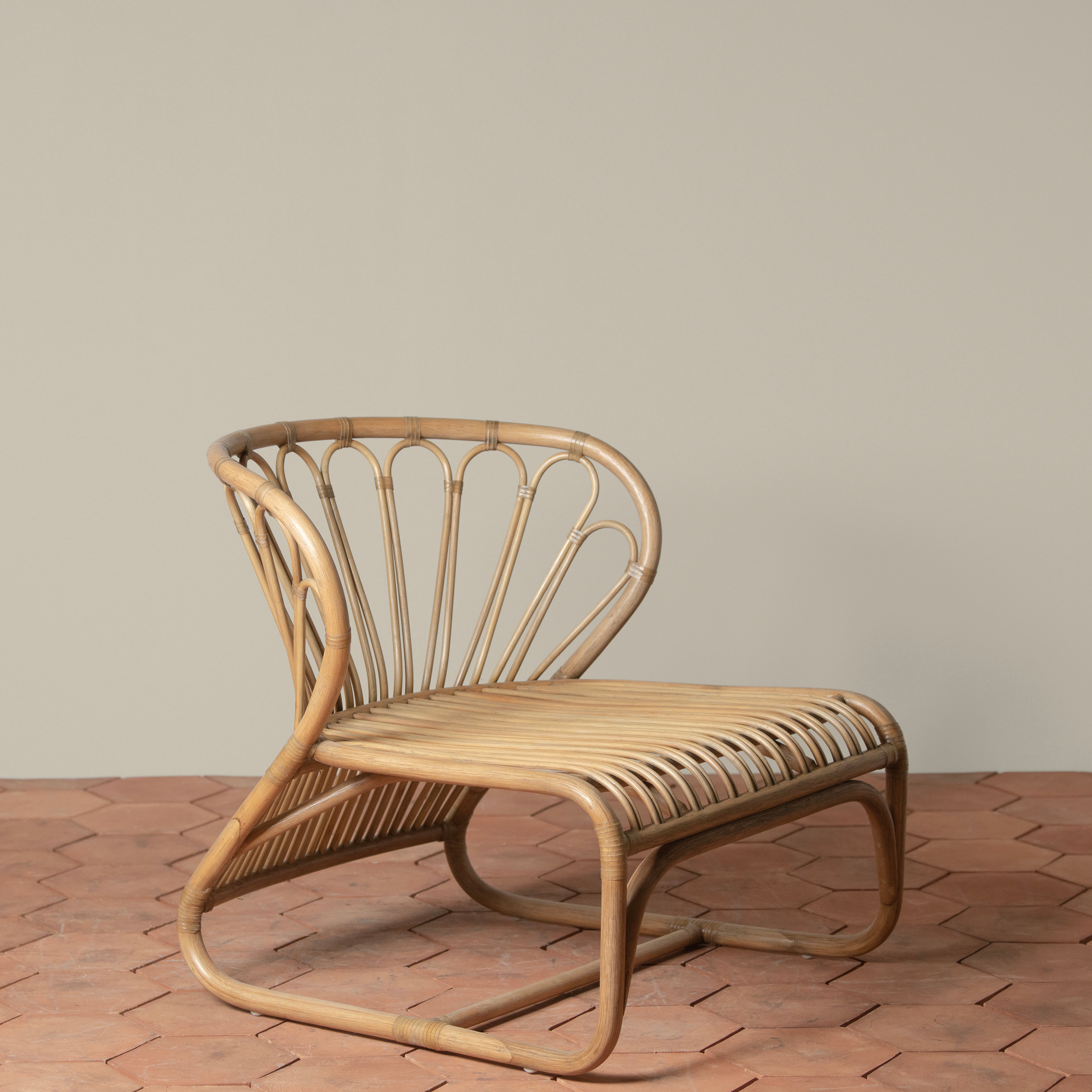 Low-Profile Handcrafted Indonesian Rattan & Belgian Linen Outdoor Lounge Chair with Rawhide Accents for Patio or Garden