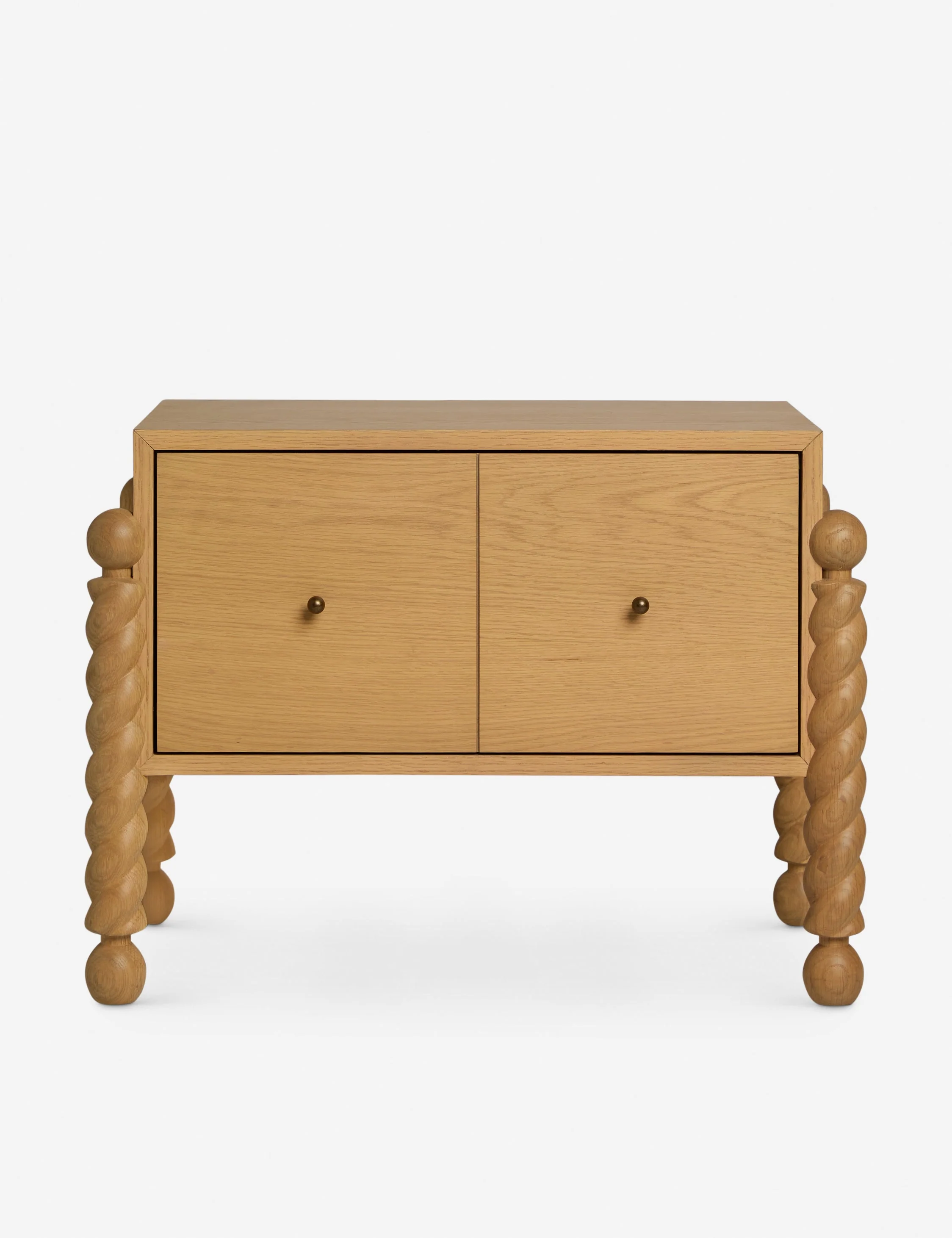 Nightstand - With a refined blend of shape and line, the nightstand showcases sculptural, turned legs that frame a clean-lined case